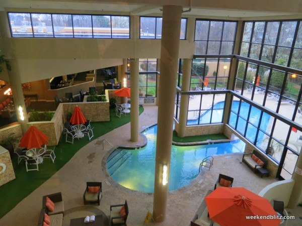 View from elevator of indoor lobby pool